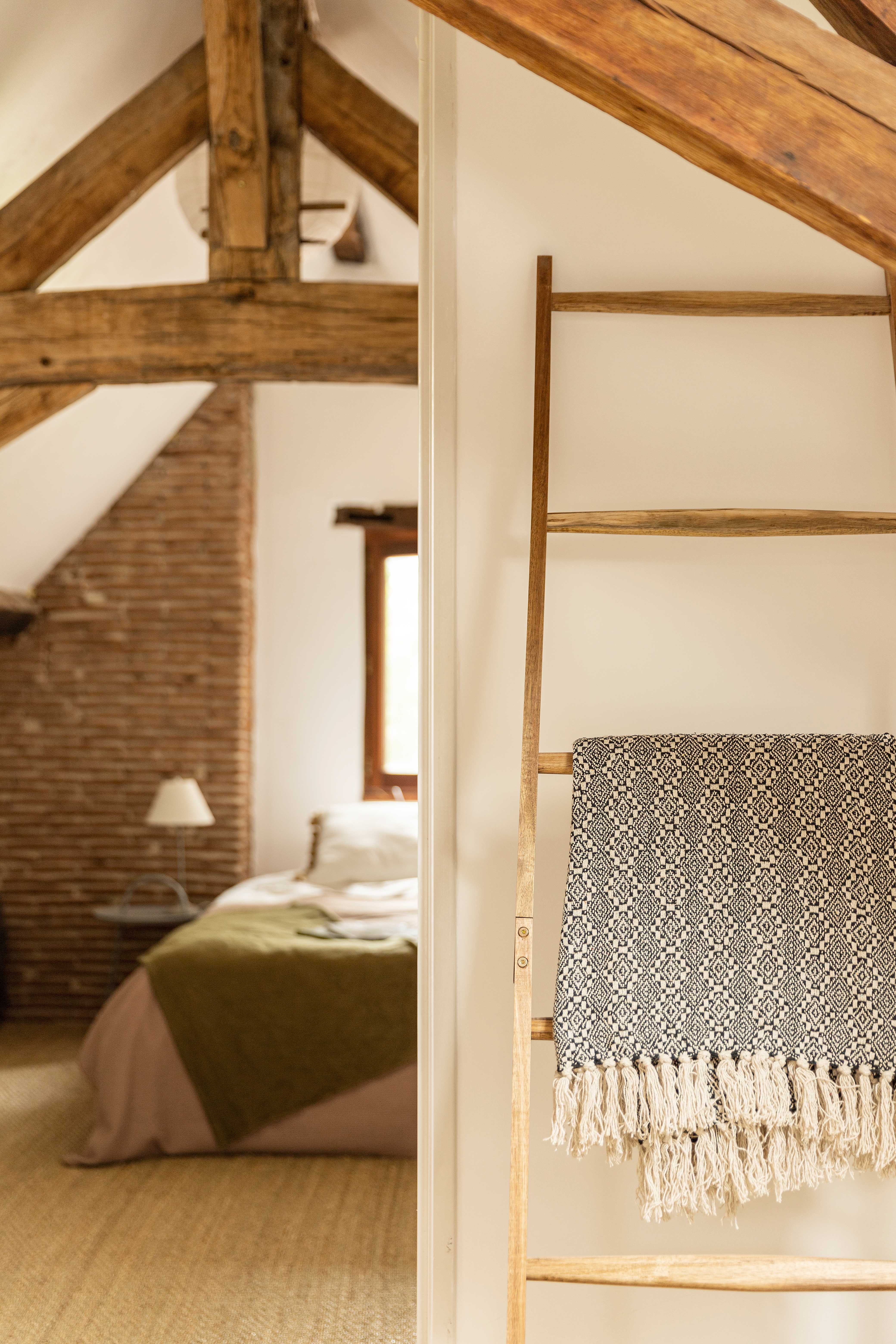Comfortable bedroom with French country decor in Dordogne