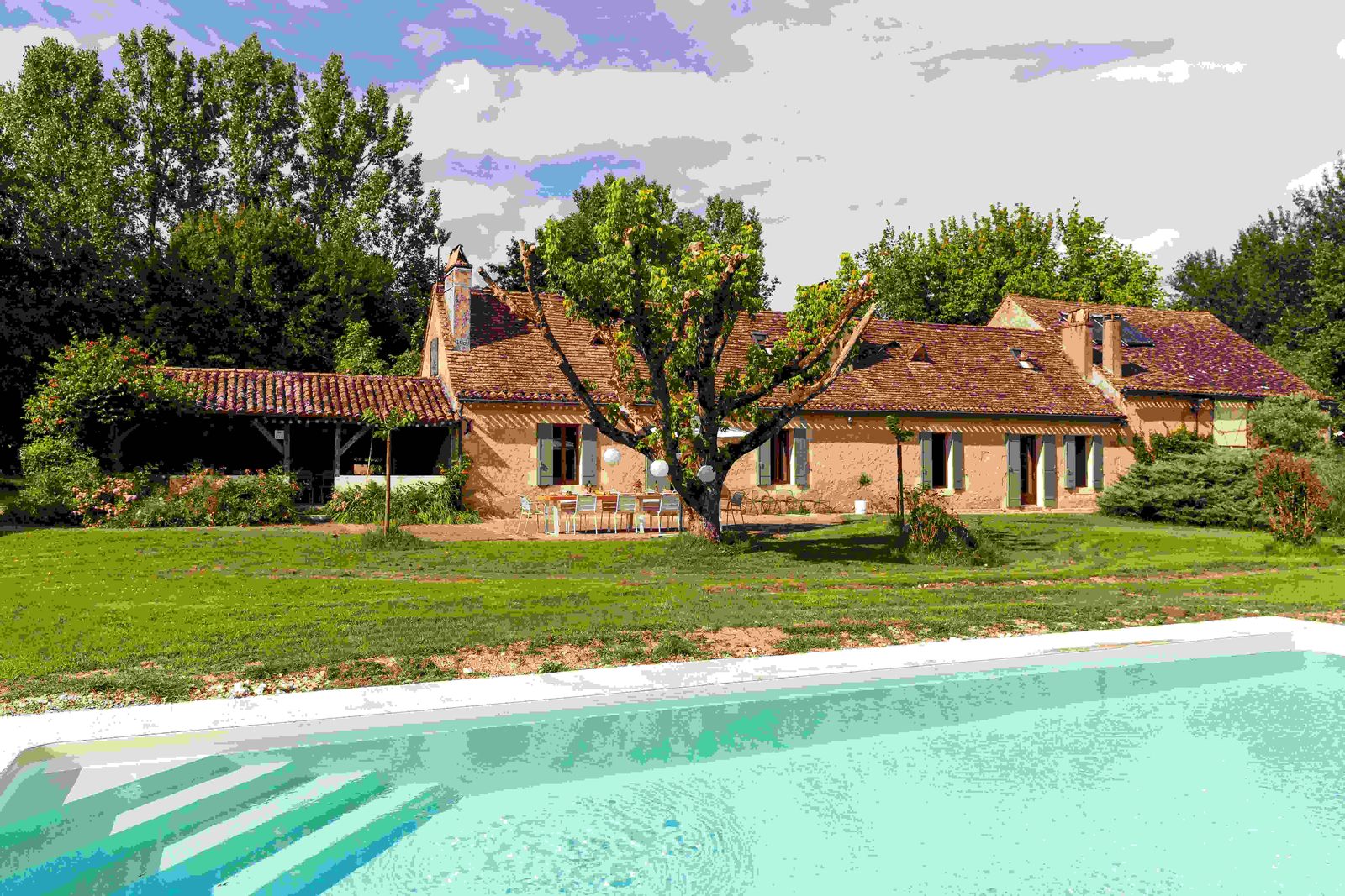 The restored stone Main House seen from the garden